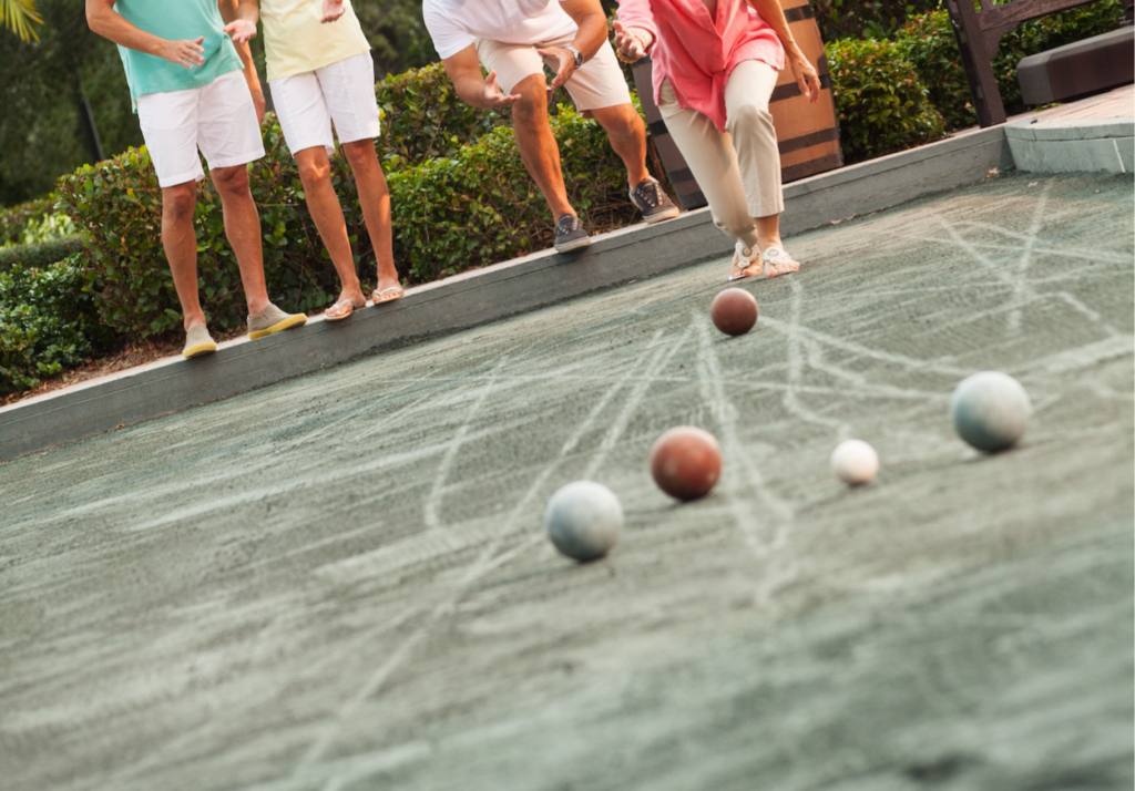A group of residents get together for some friendly competition over a game of bocce ball at the garden pavilions