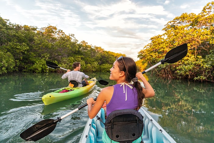 bigstock-Couple-kayaking-together-in-ma-286586047 (1)