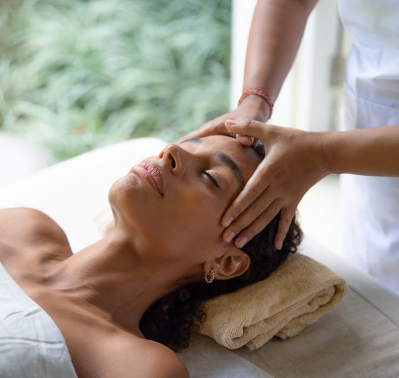A woman closes her eyes in relaxation during a massage at the spa in The Ritz-Carlton Residences, Estero Bay.