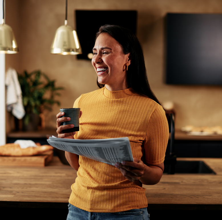 A-woman-starting-her-day-off-right-with-a-warm-cup-of-coffee-and-a-daily-newspaper_-ready-to-enjoy-a