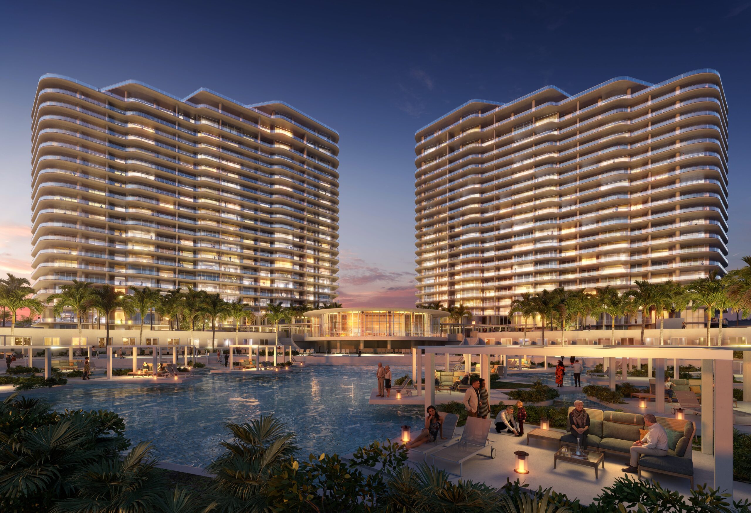The Ritz-Carlton Residences, Estero Bay towers at dusk with pools, clubhouse and lagoon